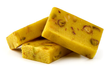 Saffron nougat bar with almonds and pistachios, isolated on white background.