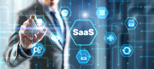 SaaS software as a service concept with hand pressing a button