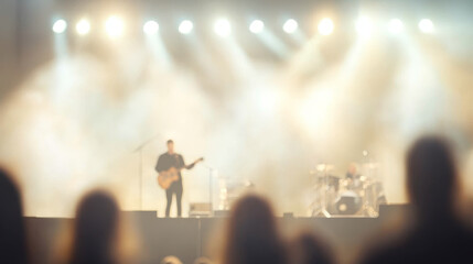 Live house concert concept. Blurry silhouette of musicians performing on stage with bright lights