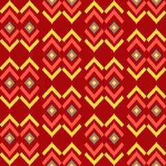 Vibrant Geometric Pattern with Repeating Diamond and Chevron Shapes in Warm Tones of Red, Orange, and Yellow, Creating a Symmetrical and Intricate Design Suitable for Textiles, Wallpapers, fabric