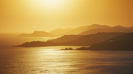 Golden Sunset Over Serene Ocean and Mountain Horizon