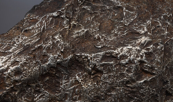 Rough meteorite surface, abstract natural background photo texture