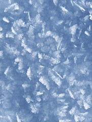 Background of winter snow texture. Small ice crystals on surface of snow natural background