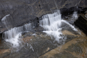 Water cascading around rocks