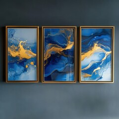 A set of three fluid art posters framed in elegant gold 8x12" frames, featuring captivating blue and gold accents, perfect for adding a touch of sophistication to any space.