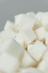 Cubes of white crystalline beetroot refined sugar.