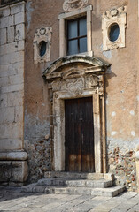 old antique door to the church of St. Catherine in Taormina, Sicily
