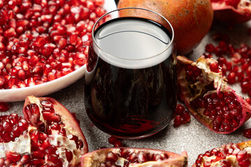 Natural pomegranate juice in a glass, close-up.