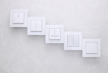 Light Switches on a Grey Concrete background