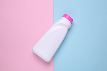 Bottle of washing gel on blue pink background