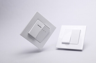 Light switches on a gray background
