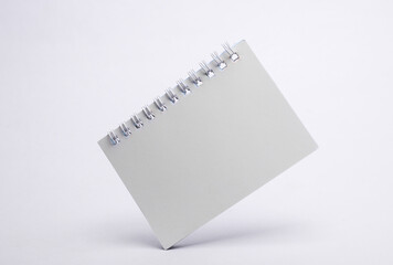 White notebook floating on white background