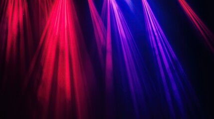 Fototapeta premium Vibrant red and blue light rays intersect forming dramatic and energetic visual