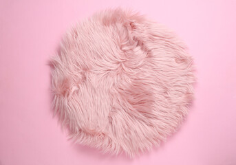 Fuzzy fluffy pink pillow on pink background. Top view © splitov27