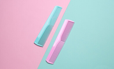 Set of plastic combs on pink blue background. Top viiew