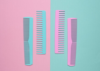 Set of plastic combs on pink blue background. Top viiew