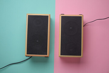 Acoustic speakers on a blue pink background. View from above