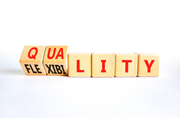 Quality or flexibility symbol. Concept words Quality Flexibility on wooden cubes. Beautiful white table white background. Business and quality or flexibility concept. Copy space.