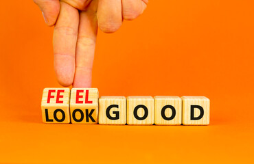 Look and feel good symbol. Concept words Look good Feel good on wooden cubes. Beautiful orange table orange background. Doctor hand. Healthy lifestyle look and feel good concept. Copy space.