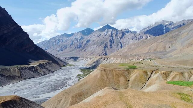 An aerial view of the pangmo village with spiti river and himalayan mountains in spiti valley. Pangmo village is located in spiti tehsil of lahul and spiti district in himachal pradesh, India.