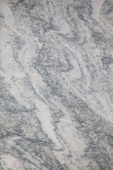 Fototapeta premium Gray and white marble stone texture background. vertical orientation