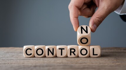 Businessman hand placing wooden block, word control.
