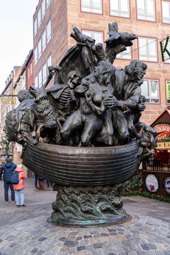 Nuremberg, Germany - December 4, 2024: Famous Ship of Fools sculpture as seen during the Christmas Market. Narrenschiff statue in Nuremberg city center