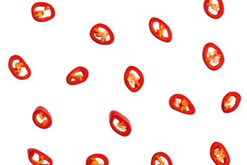 Vibrant chopped red chili peppers scattered against a plain background, enhancing a spicy and lively culinary theme.