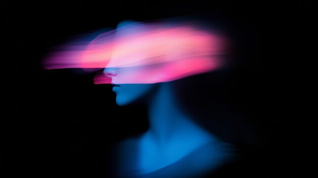 Light painting portrait created using camera's long exposure with colorful light streaks across face against a dark background, resulting in a surreal and artistic effect