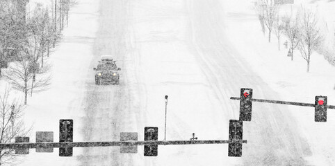 Obraz premium Driving on Snow and Snowy Roads in Winter Blizzard Cars on Icy Street