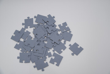 monochromatic puzzles in a pile lying on a white background