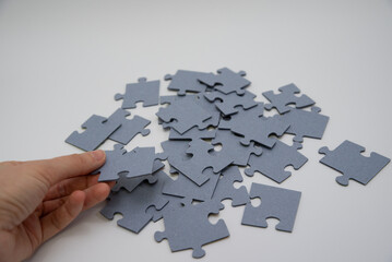 monochromatic puzzles in a pile lying on a white background