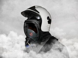 Firefighter torso at work wearing helmet with open shield and gas mask in thick depths of smoke front side angle view