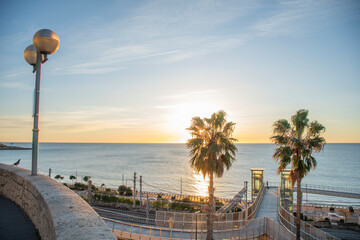 Sunrise on the seafront of Tarragona in Mediterranean coastal Spain with traditional elevators © mario