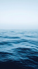 Fototapeta premium Serene Blue Ocean Waves Under a Clear Sky