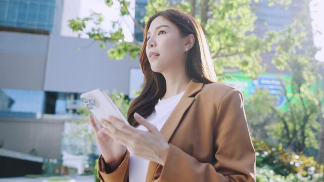 Cheerful Asian woman using phone reading good news on smartphone victory great sms receive, Joyful happy moment with smartphone, celebrate success career achieve, Smiling businesswoman reading message