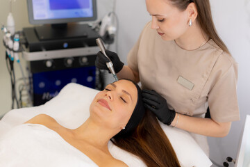 Innovative microneedling mesotherapy enhances skin rejuvenation during a relaxing beauty treatment session in a modern clinic