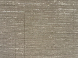Close up of grey silk linen wallpaper with 3d texture horizontal and vertical stripes. Grey linen wallpaper seamless background texture.