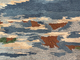 Random design with abstract pattern hand tufted carpet texture, in blue, red, and white color....