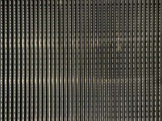 Obraz premium Close up of escalator stripes dark metal flooring seamless background texture.