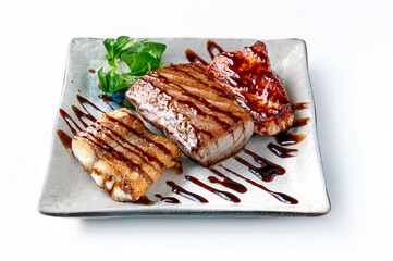 Grilled mixed fish in teriyaki sauce isolated on white backgroundage