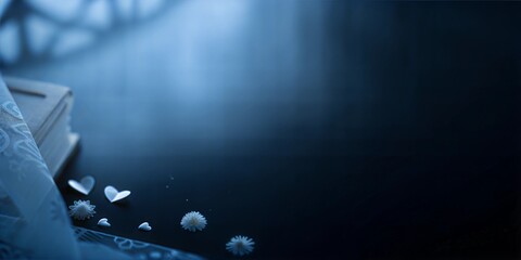 Open book with scattered decorative elements on a dark blue background