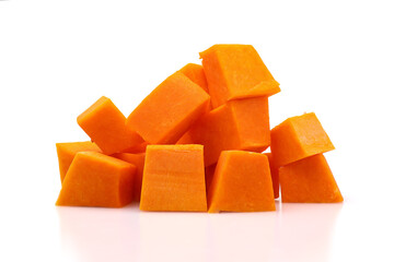 A pile of pumpkin cubes prepared for making pumpkin porridge.