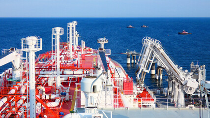 LNG at loading operation with tugboats