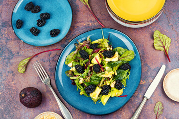 Salad with blackberries, avocado and microgreens.