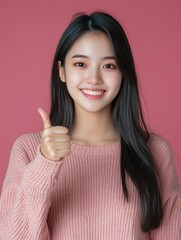 Smiling South Korean Woman in Pink Sweater, Thumbs Up