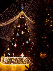 Christmas tree with illumination lights in city square