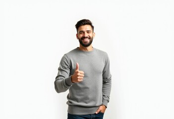 Fototapeta premium Smiling man with beard gives thumbs up in grey sweater