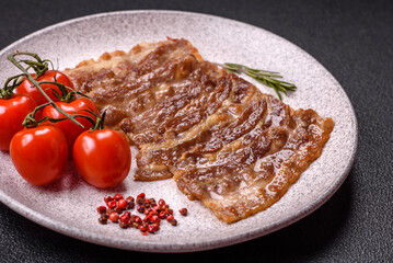 Crispy fried pork bacon sliced with salt, spices and herbs