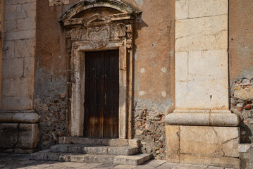 old antique door to the church of St. Catherine in Taormina, Sicily